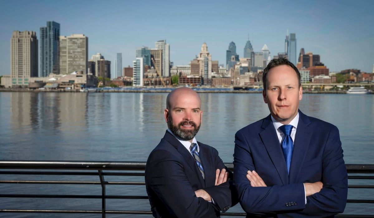 Jeremy Lackey & Derek Miller on the river with Philly in the background
