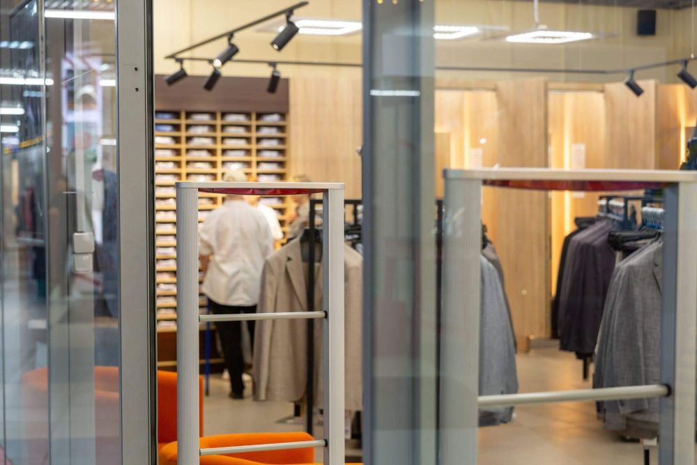 Clothing store view through a glass door, relevant