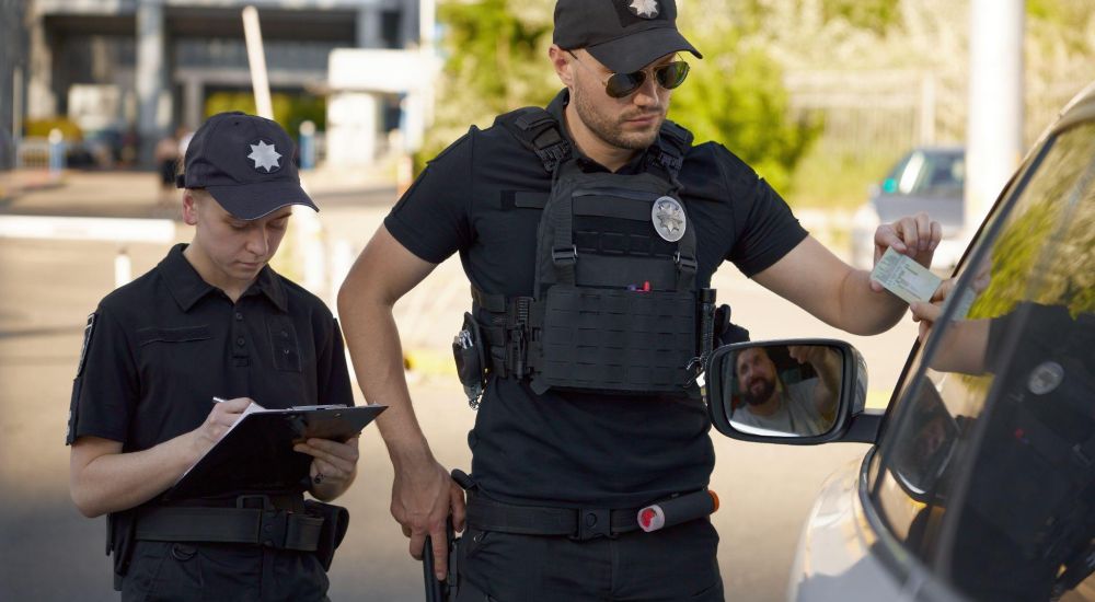 Traffic stop while driving.