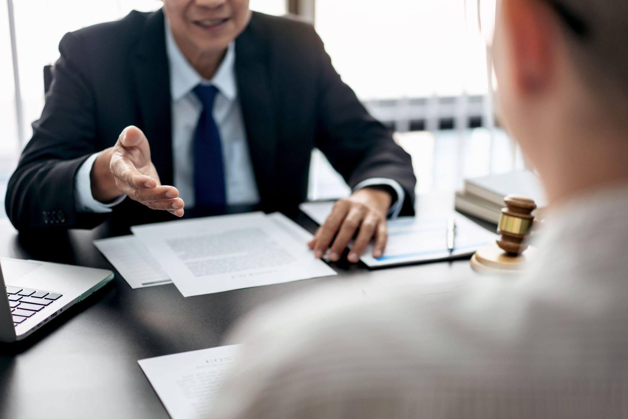 Man at desk with judge, New Jersey criminal mischief